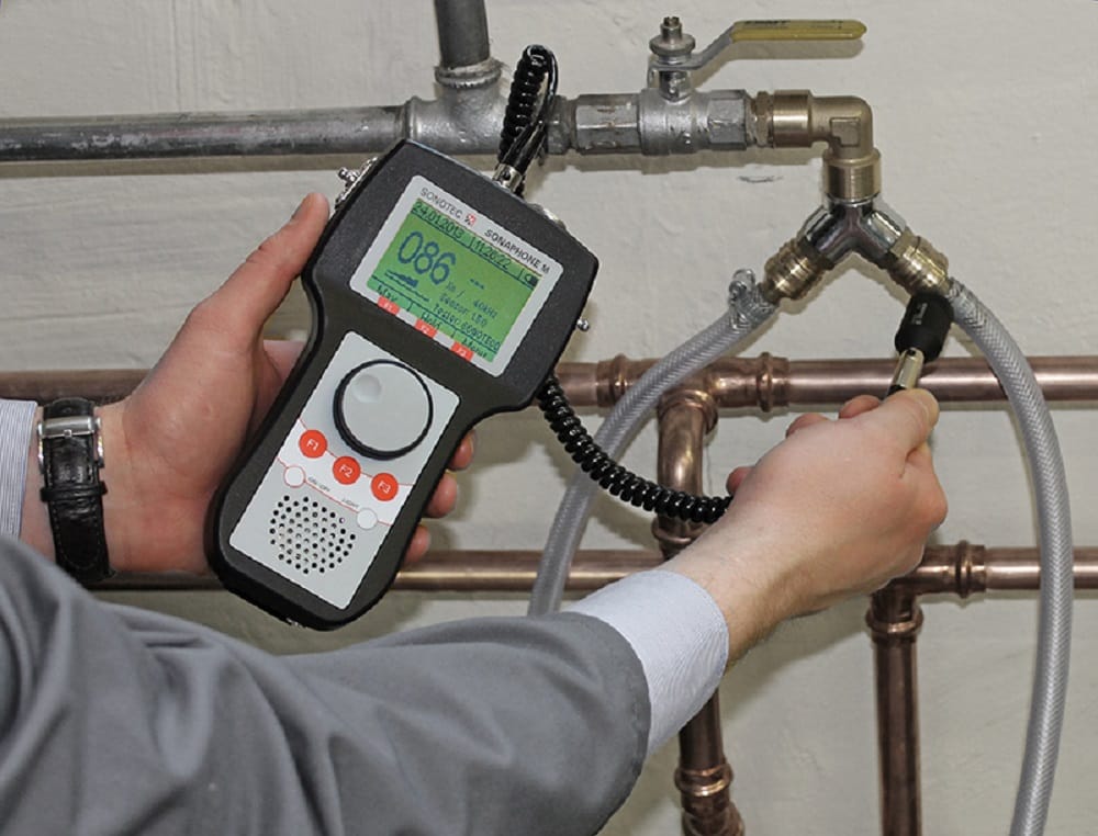 Plumber testing pipes with electronic leak detection equipment in Maitland